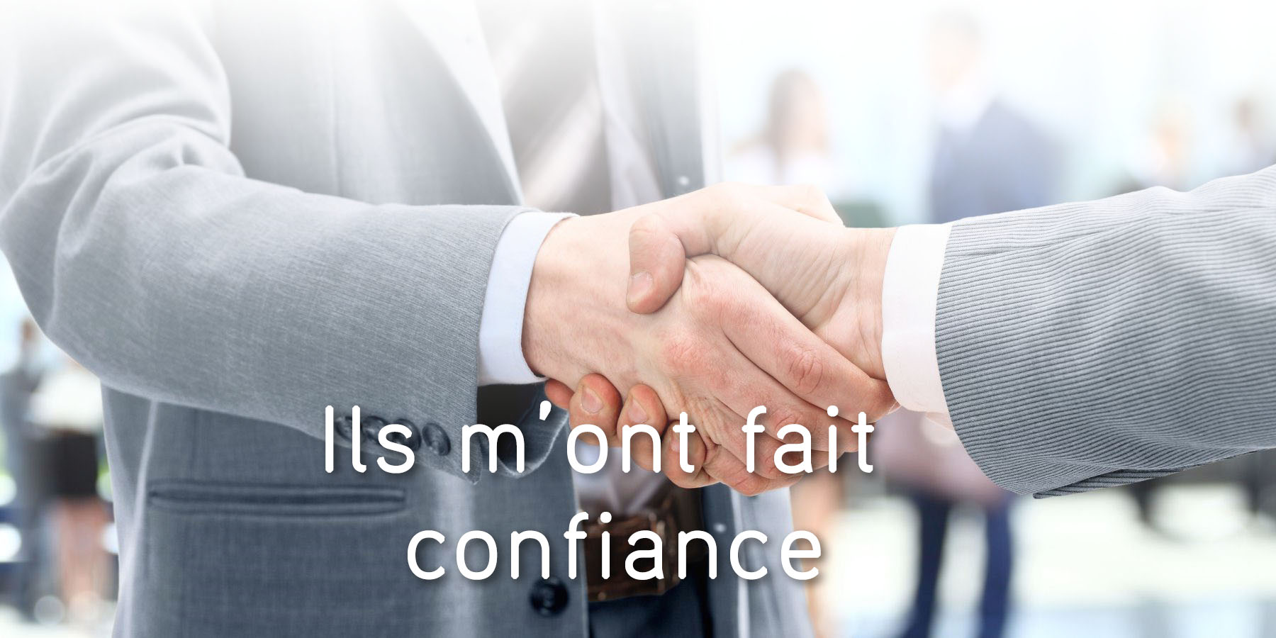 Handshake in front of business people